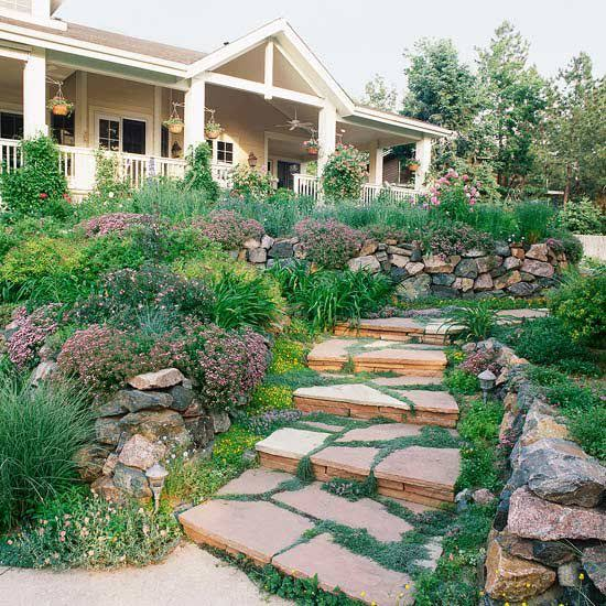 Natural stone garden steps leading toward a porch